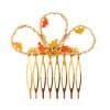 Peinecillo dorado pintado en naranja y amarillo