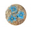 Broche de porcelana color agua marina con reflejos dorados