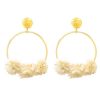Flamenco gold earring with ivory fabric flower and golden highlights